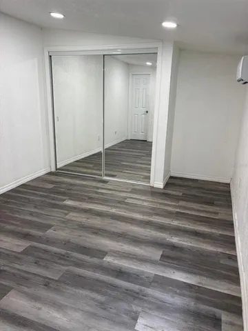 a view of a kitchen with a sink a refrigerator and a window