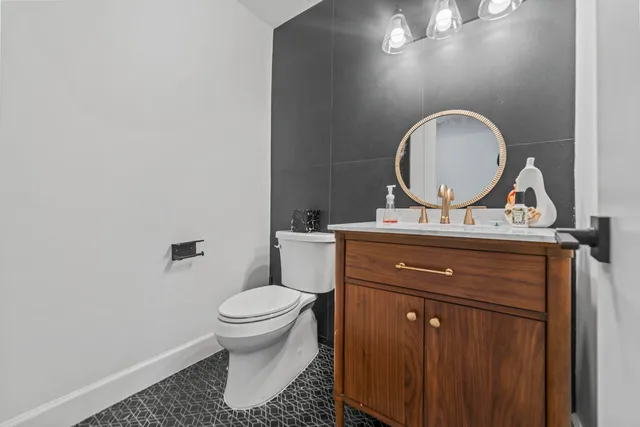 a spacious bedroom with a bed and a flat screen tv