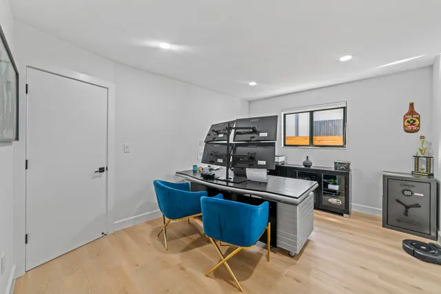 a bedroom with furniture and a window