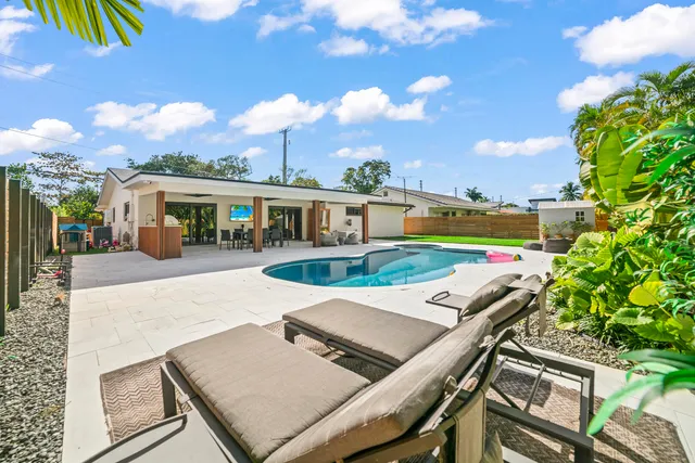 a view of a swimming pool with a patio