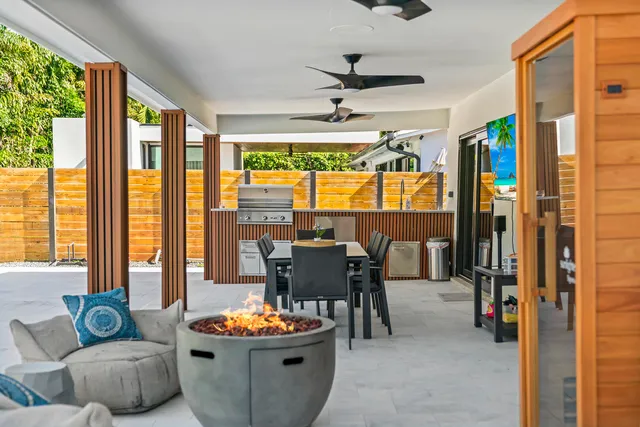 a living room with furniture and a potted plant