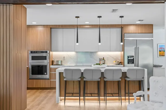 a kitchen with a sink a counter top space and cabinets