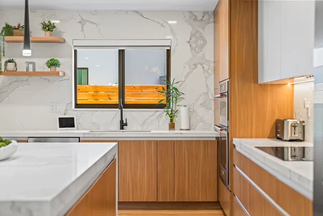 a kitchen with a sink and a refrigerator