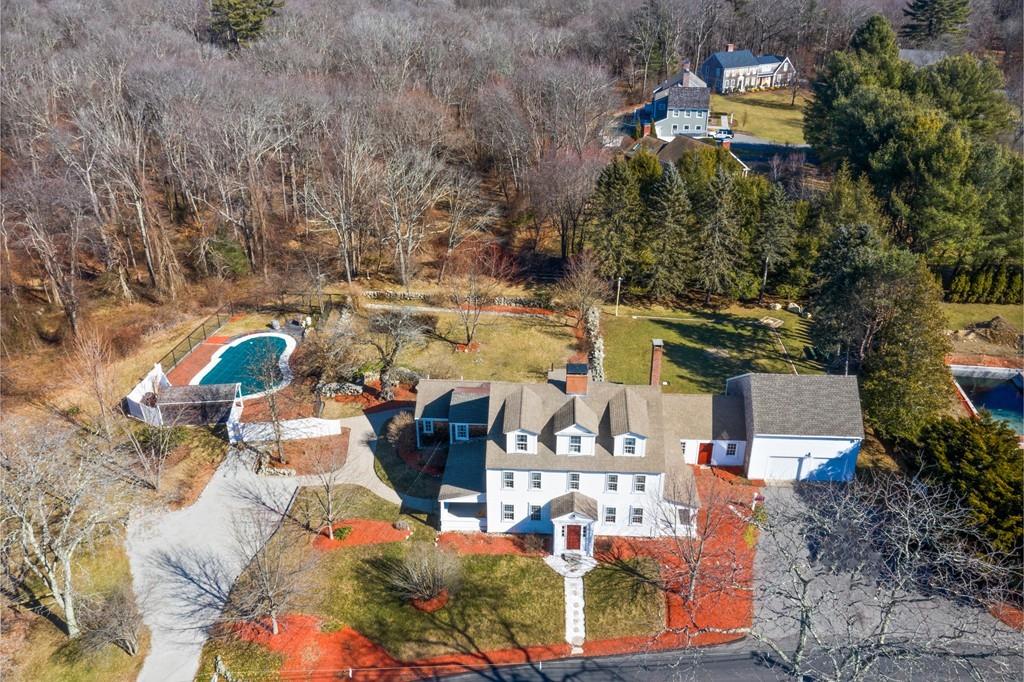 an aerial view of a house with outdoor space
