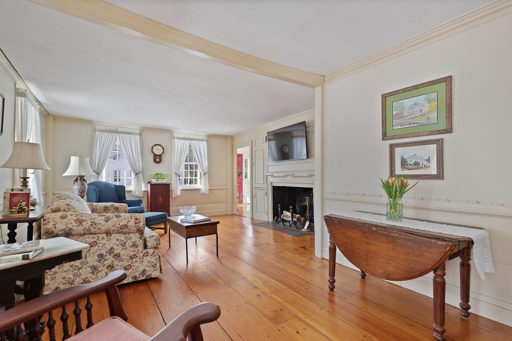 220 Prospect Street Hingham, MA 02043 - Photo 12 of 41 a living room with furniture a fireplace and a table