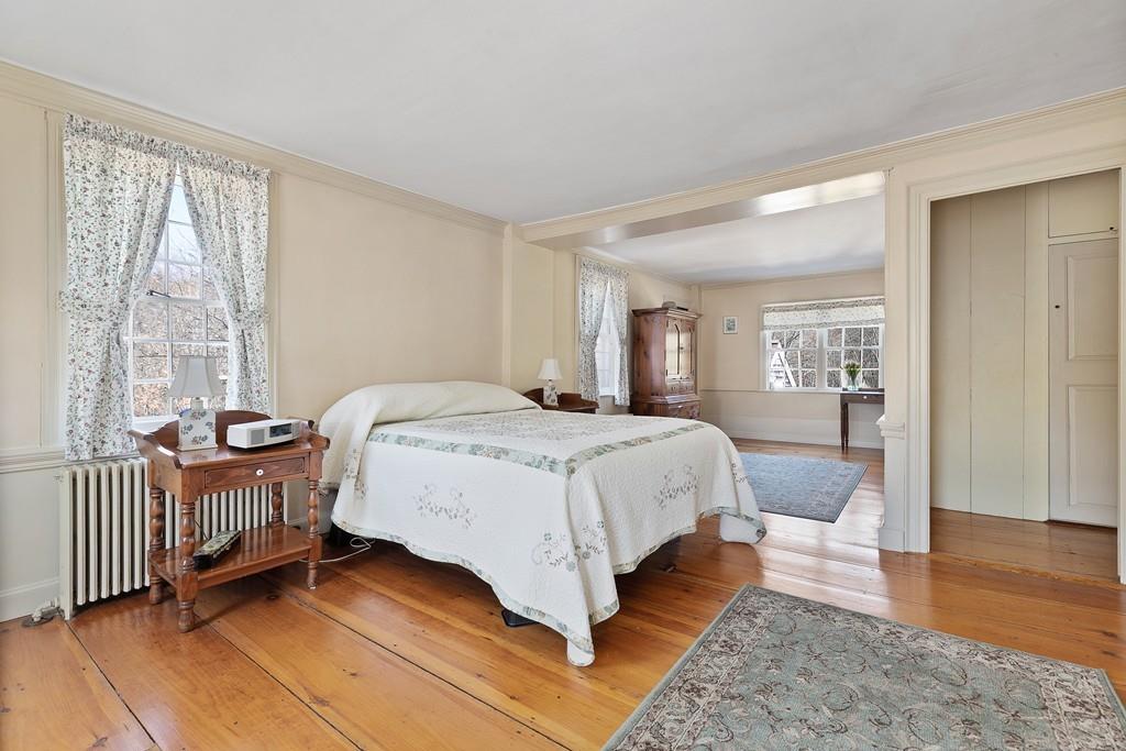 220 Prospect Street Hingham, MA 02043 - Photo 20 of 41 a spacious bedroom with a bed and wooden floor