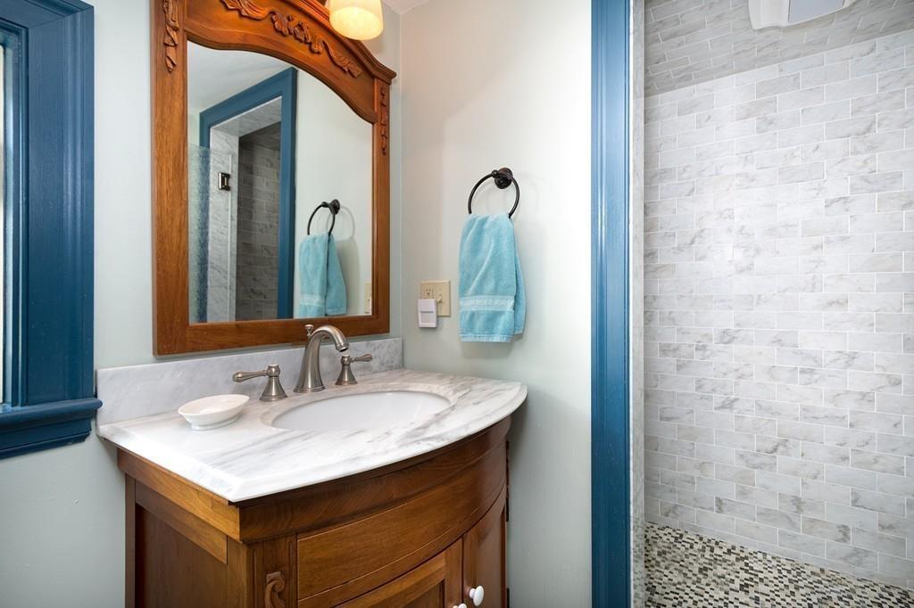 220 Prospect Street Hingham, MA 02043 - Photo 23 of 41 a bathroom with a sink vanity and a mirror