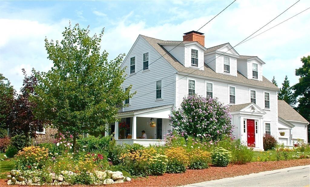 220 Prospect Street Hingham, MA 02043 - Photo 32 of 41 a front view of a house with plants and trees