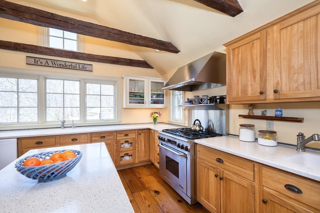 220 Prospect Street Hingham, MA 02043 - Photo 5 of 41 a kitchen with stainless steel appliances a sink a stove and a window