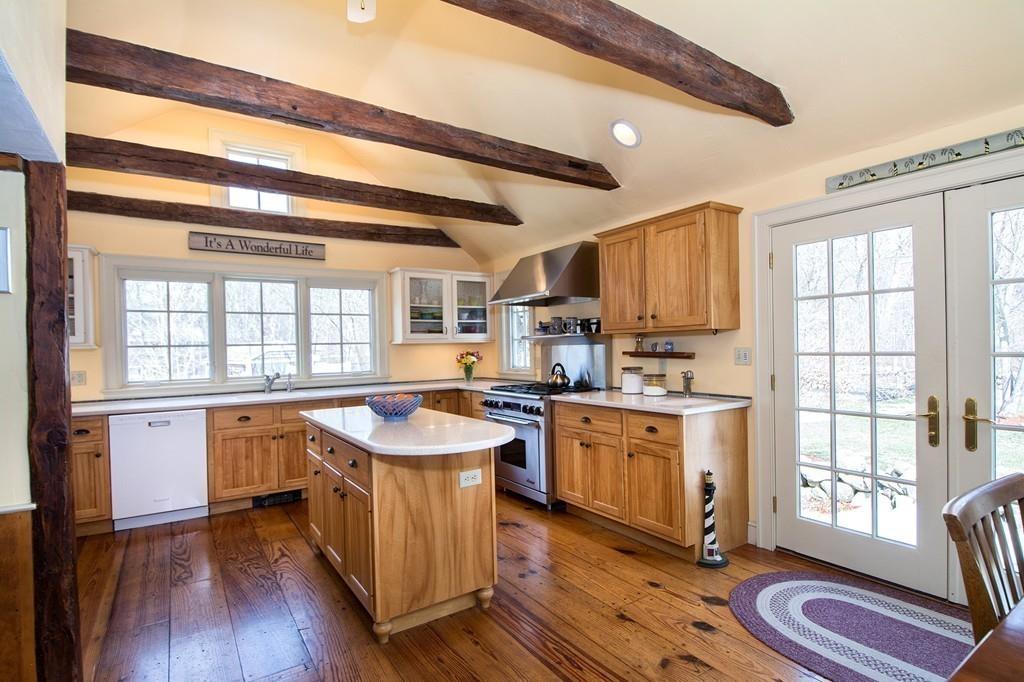 220 Prospect Street Hingham, MA 02043 - Photo 7 of 41 a kitchen with stainless steel appliances granite countertop a sink stove and wooden cabinets