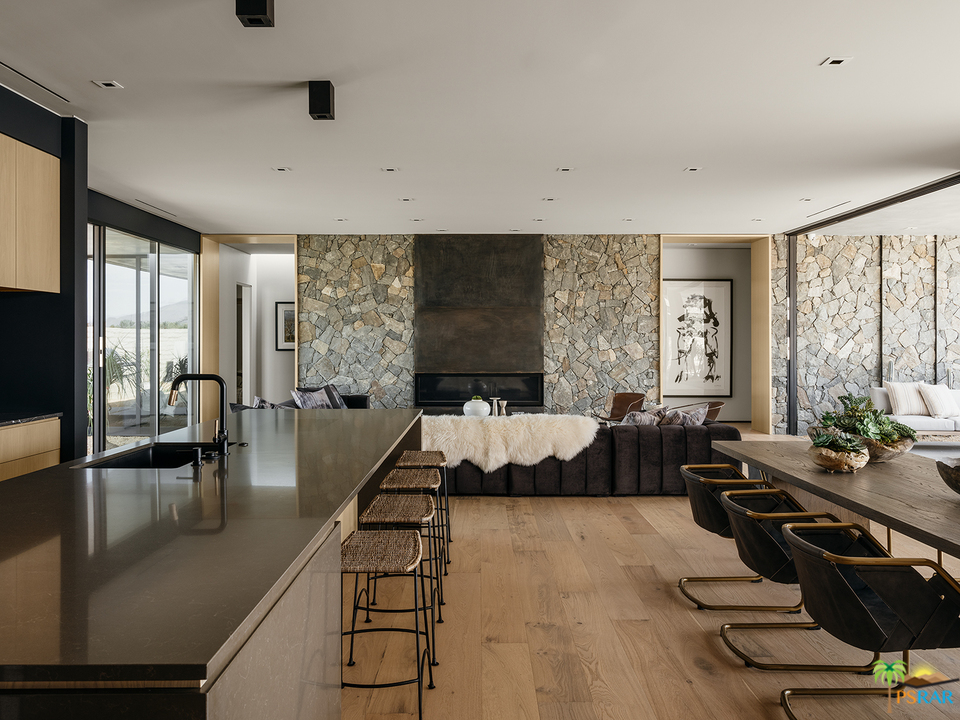 2 Echo Lane Rancho Mirage, CA 92270 - Photo 18 of 40 a living room with furniture floor to ceiling window and wooden floor