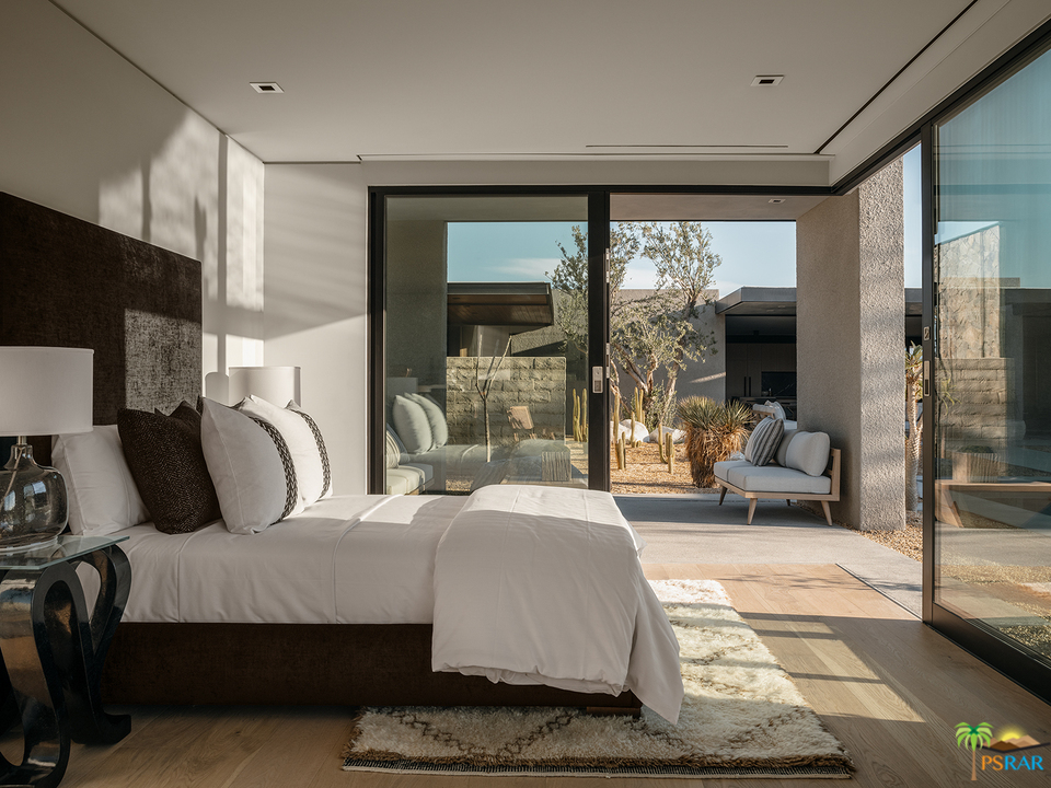 2 Echo Lane Rancho Mirage, CA 92270 - Photo 28 of 40 a bedroom with a large bed and large windows