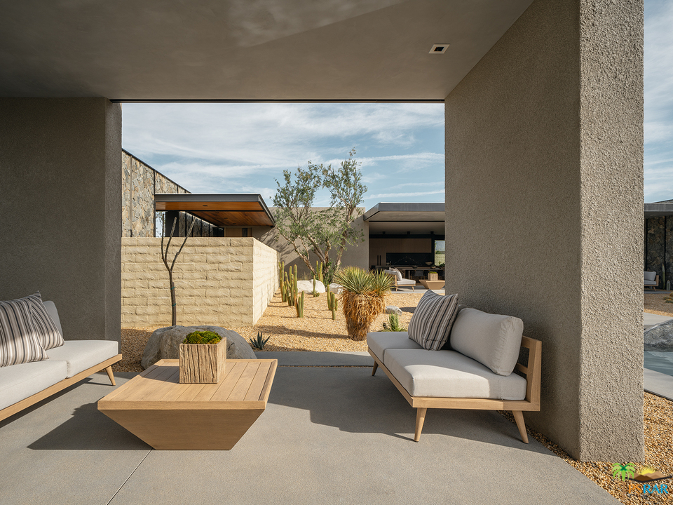 2 Echo Lane Rancho Mirage, CA 92270 - Photo 39 of 40 a living room with furniture and a fireplace