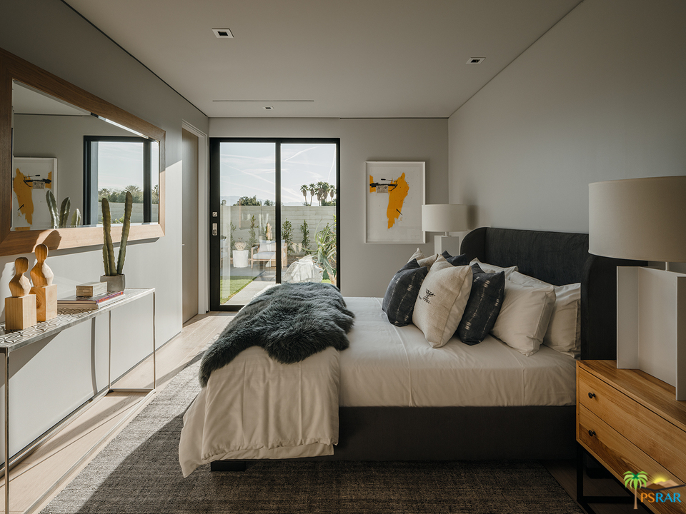 2 Echo Lane Rancho Mirage, CA 92270 - Photo 6 of 40 a bedroom with a bed and a large window