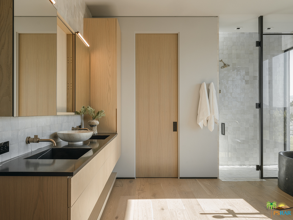 2 Echo Lane Rancho Mirage, CA 92270 - Photo 8 of 40 a bathroom with a sink and a mirror