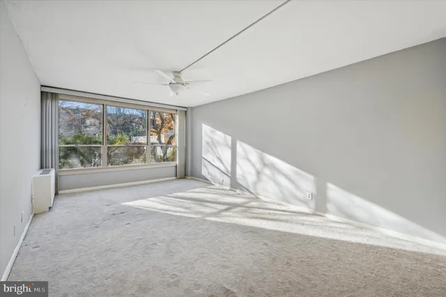 a view of an empty room with a window