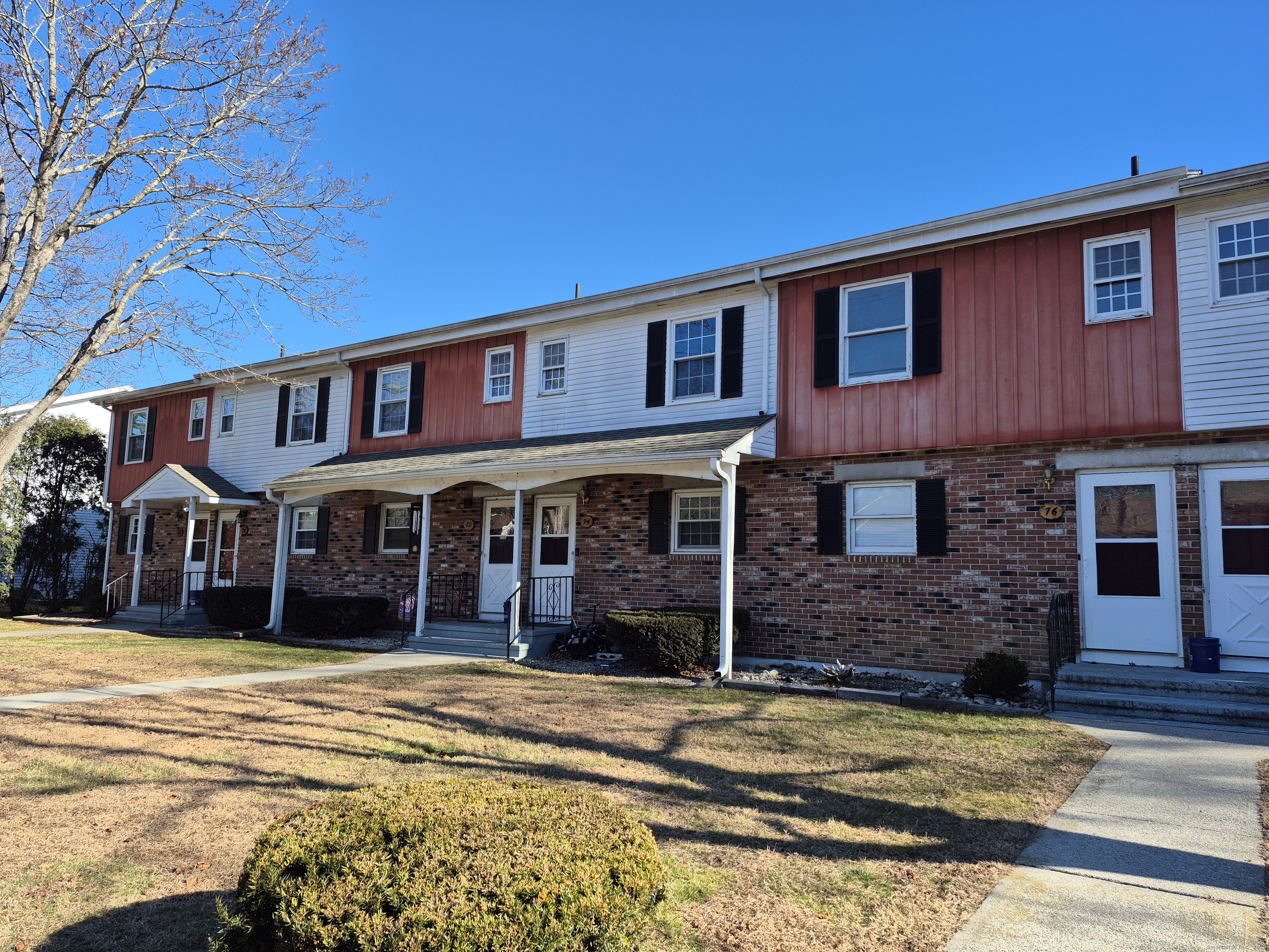 a front view of a house with a yard