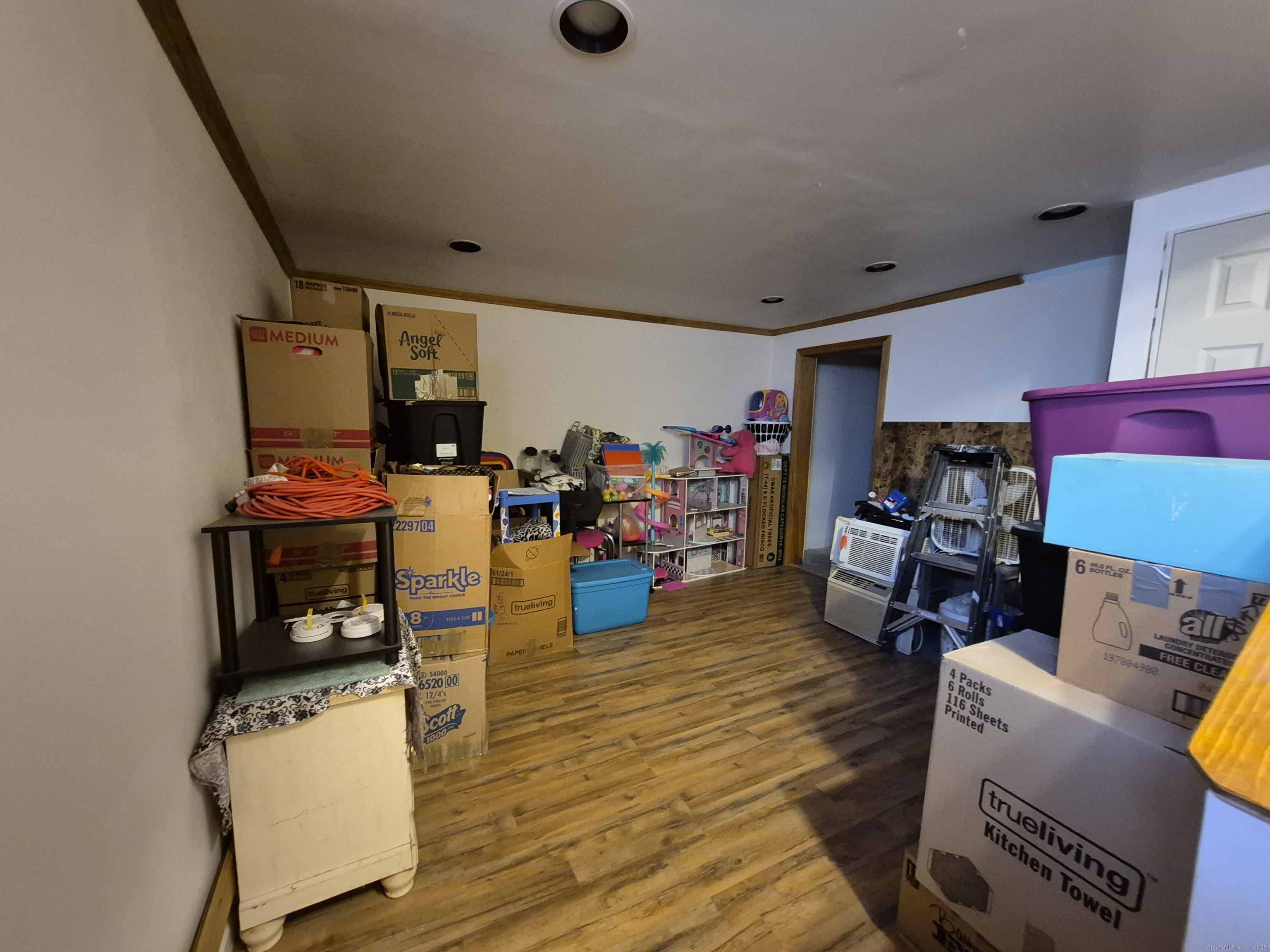 74 Athol Street, Unit 74 Killingly, CT 06239 - Photo 13 of 15 a living room with furniture and a wooden floor