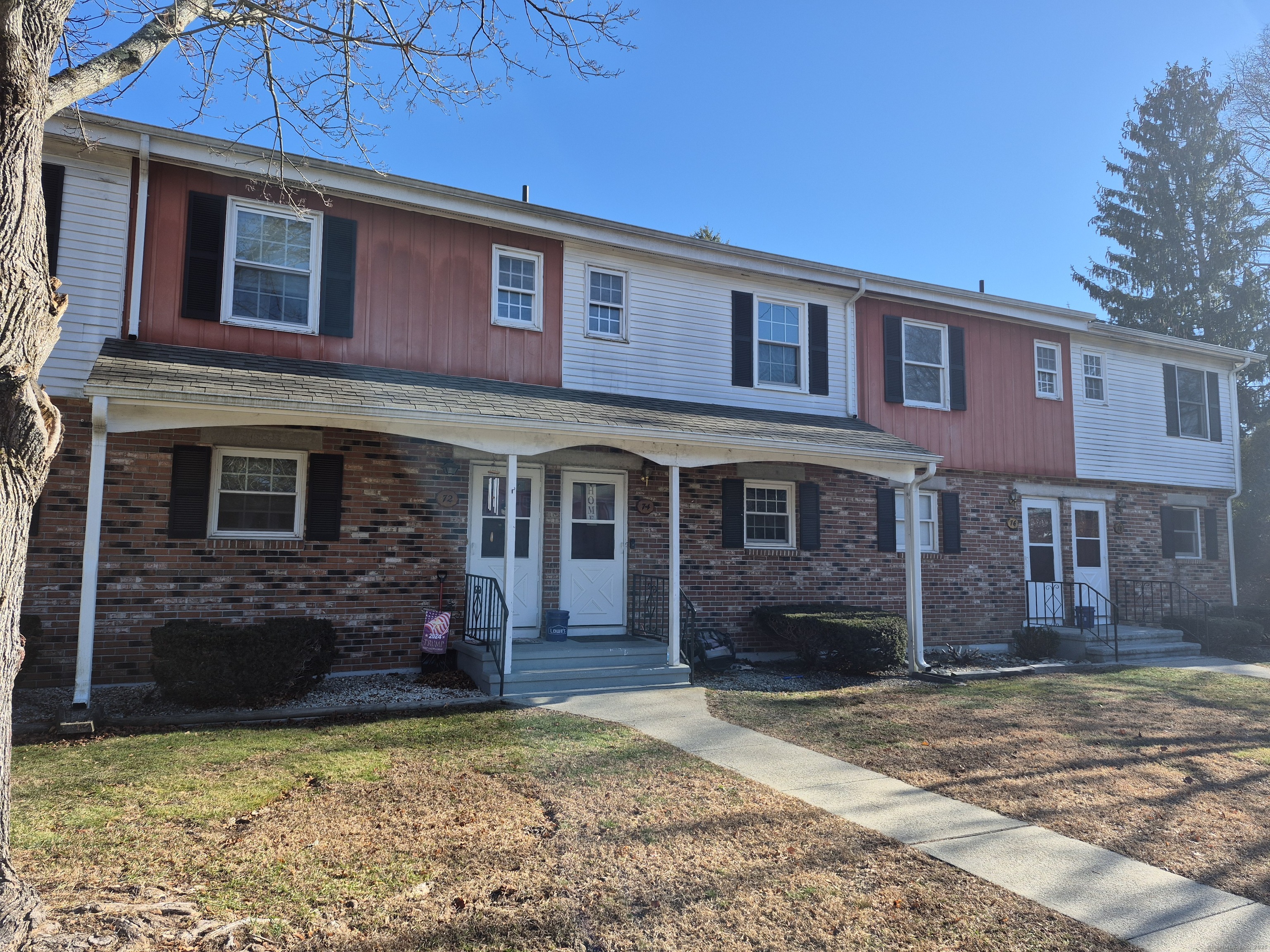74 Athol Street, Unit 74 Killingly, CT 06239 - Photo 2 of 15 a brick building that has a lots of windows in it
