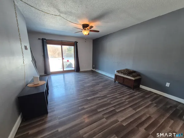a view of a livingroom with wooden floor