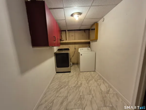 a view of a storage & utility room with washer and dryer