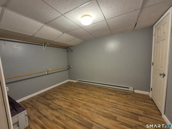 a view of a room with wooden floor