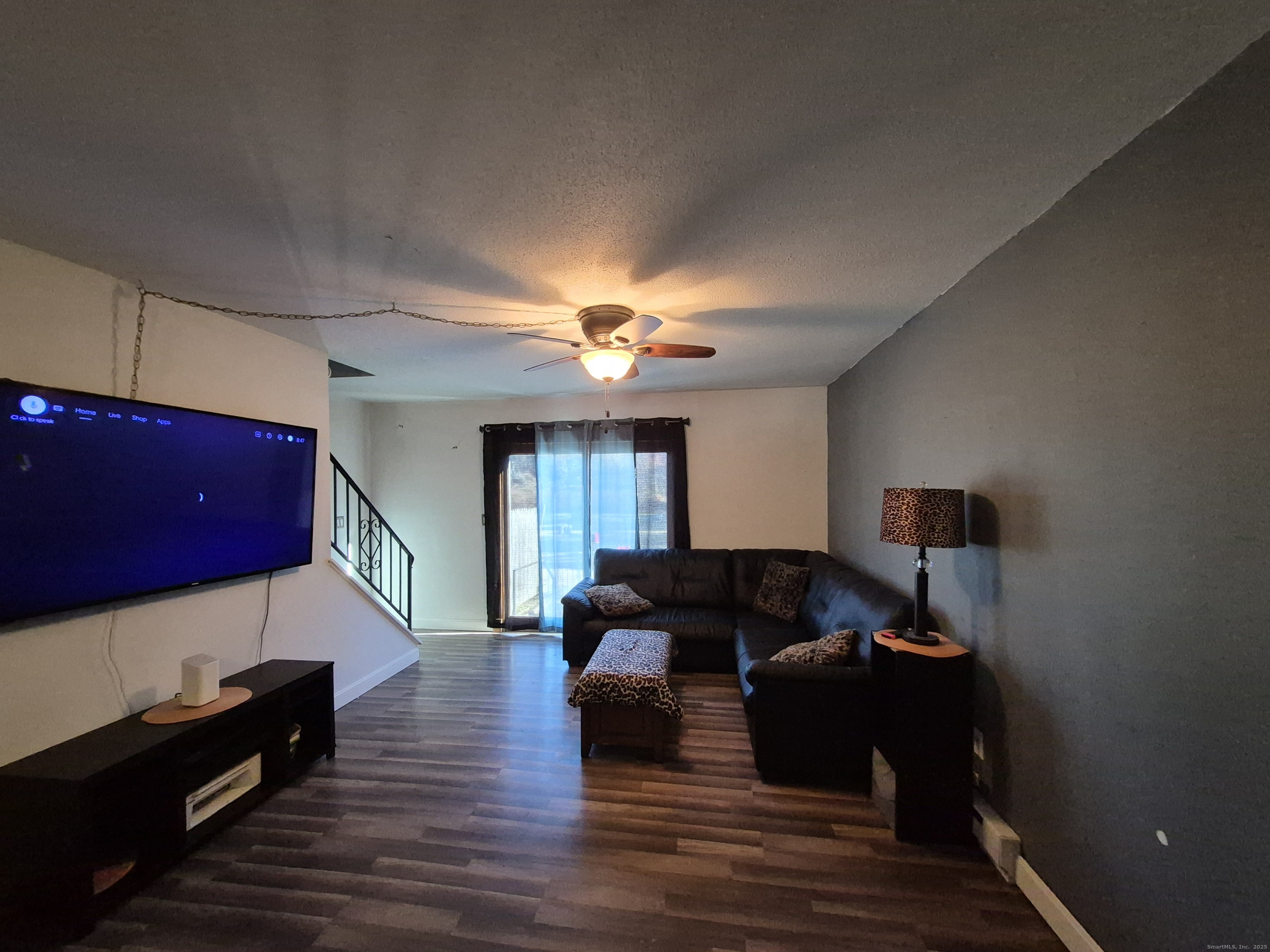 74 Athol Street, Unit 74 Killingly, CT 06239 - Photo 8 of 15 a living room with furniture and a ceiling fan
