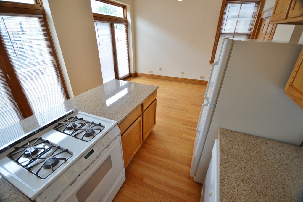 713 West Wrightwood Avenue, Unit 2R Chicago, IL 60614 - Photo 3 of 8 a view of wooden floor and windows
