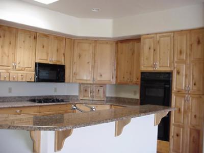 817 West Sedona Ridge Place Oro Valley, AZ 85755 - Photo 5 of 6 a kitchen with granite countertop a sink a stove and a microwave