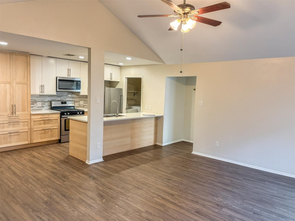 7006 Ivory Key Court, Unit A Austin, TX 78745 - Photo 2 of 16 a view of wooden floor and a kitchen