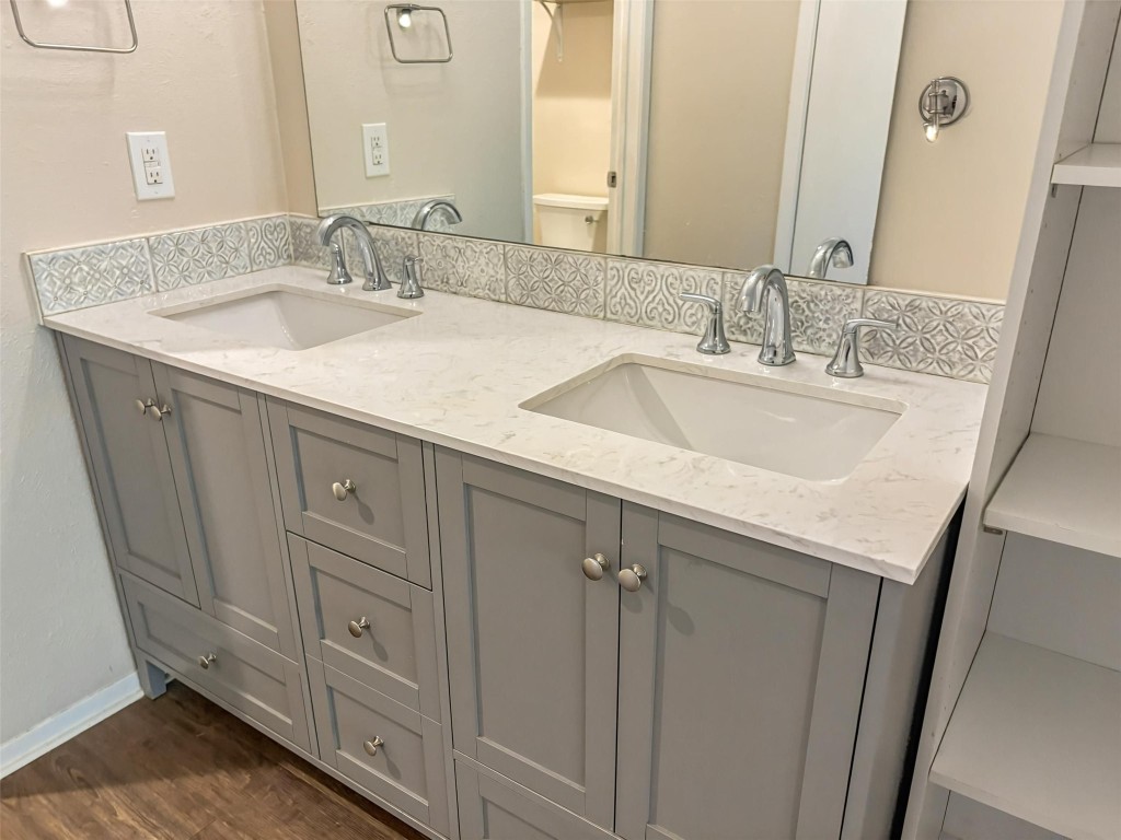 7006 Ivory Key Court, Unit A Austin, TX 78745 - Photo 9 of 16 a bathroom with a sink and a mirror