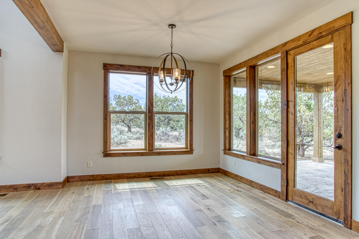 15751 South W Brasada Ranch Road, Unit LOT 363 Powell Butte, OR 97753 - Photo 16 of 47 a view of an empty room with wooden floor and a window