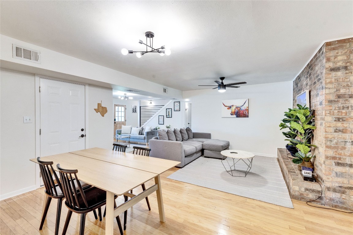 3306 South Pleasant Valley Road Austin, TX 78741 - Photo 15 of 28 a view of a dining room with furniture and wooden floor