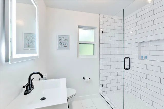 a bathroom with a sink and mirror