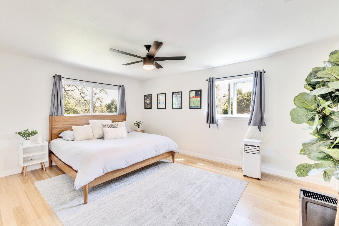 3306 South Pleasant Valley Road Austin, TX 78741 - Photo 21 of 28 a bedroom with a large bed and a window