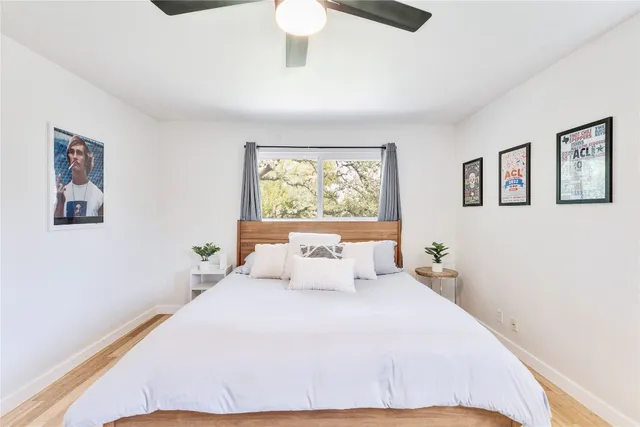 a bedroom with a large bed and a window