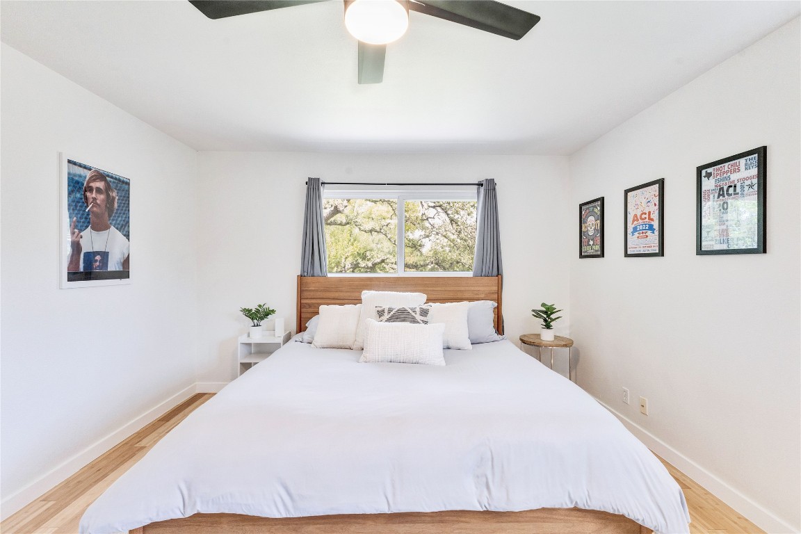 3306 South Pleasant Valley Road Austin, TX 78741 - Photo 22 of 28 a bedroom with a large bed and a window