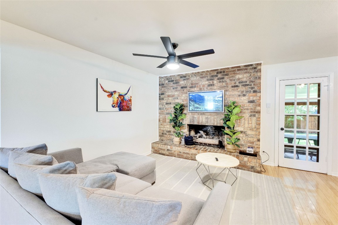 3306 South Pleasant Valley Road Austin, TX 78741 - Photo 7 of 28 a living room with furniture and a fireplace