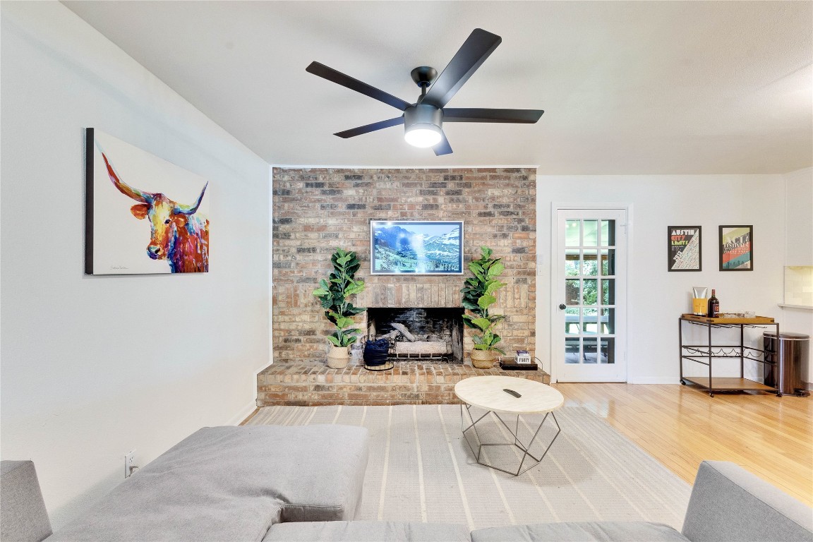 3306 South Pleasant Valley Road Austin, TX 78741 - Photo 10 of 28 a living room with furniture and a fireplace