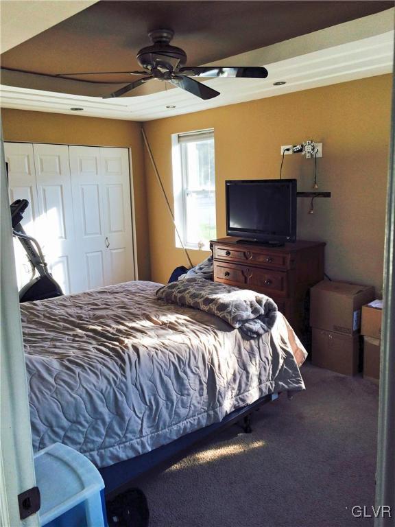 4811 Huckleberry Road Orefield, PA 18069 - Photo 4 of 11 a bedroom with a bed and a flat screen tv