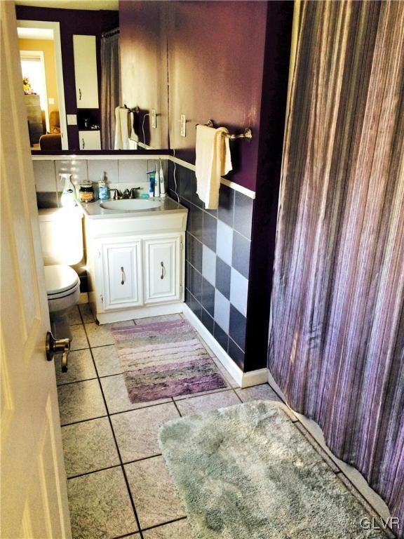 4811 Huckleberry Road Orefield, PA 18069 - Photo 5 of 11 a view of a bathroom with a sink and mirror