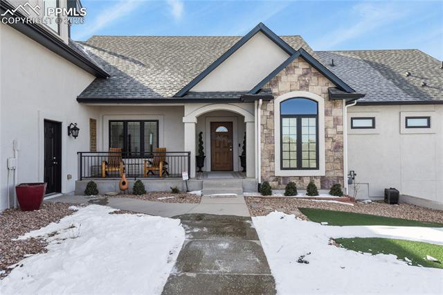 5220 Roundup Ridge Road Colorado Springs, CO 80908 - Photo 4 of 50 Landscaped area leading to front door