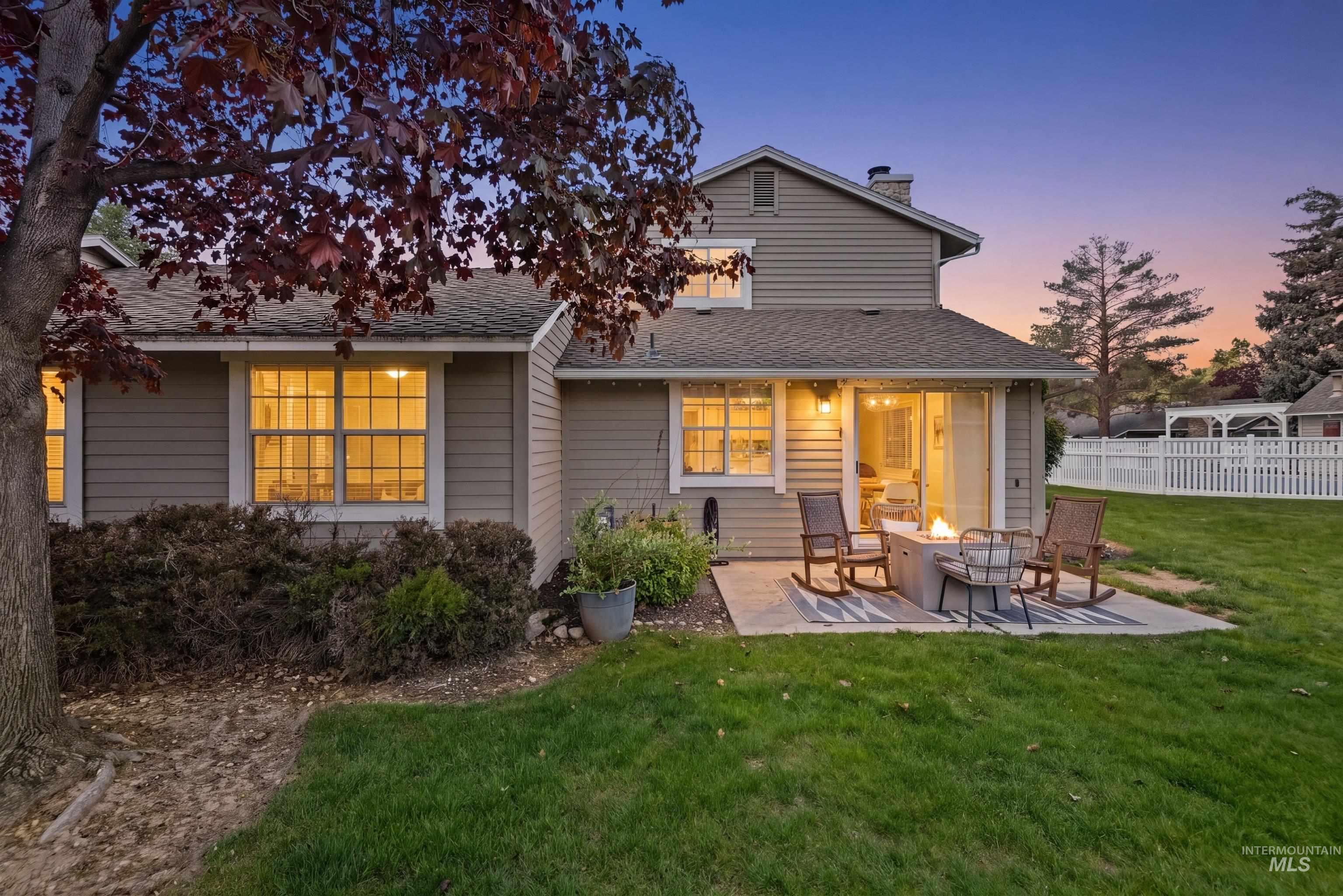 220 East Carter Street Boise, ID 83706 - Photo 1 of 1 Rear exterior featuring horizontal siding, a patio with a built-in fire pit, and a sliding glass door