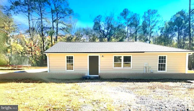 a house with trees in the background