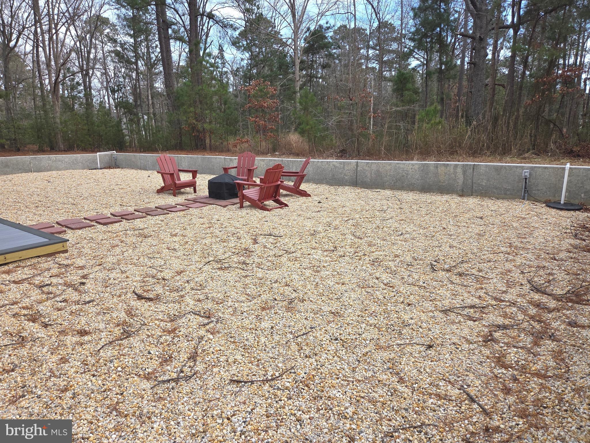 927 Susquehanna Road Madison, MD 21648 - Photo 6 of 26 a backyard of a house with table and chairs