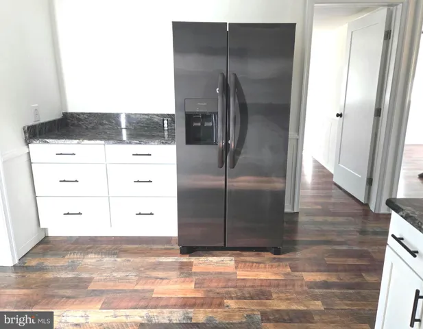 a view of a refrigerator in kitchen