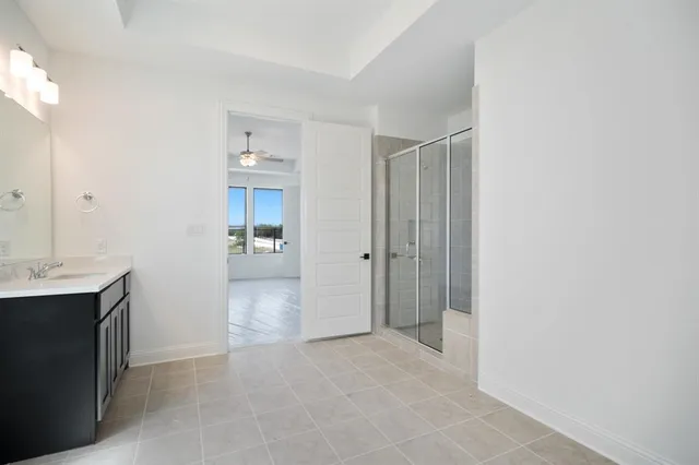 a view of a hallway to kitchen with wooden floor