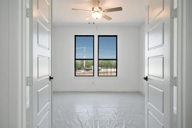 a view of an empty room with a window