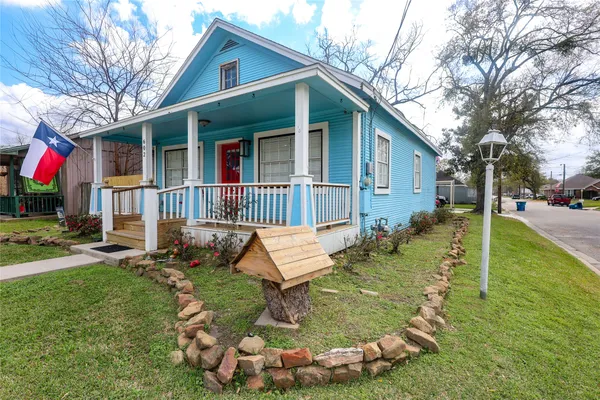 a view of a house with a yard porch and sitting area