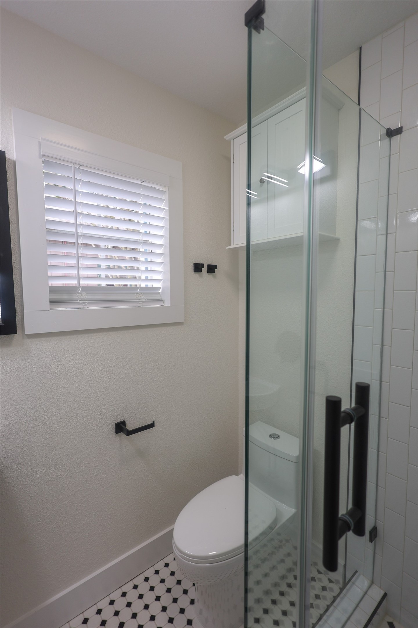 602 Higgins Street Humble, TX 77338 - Photo 22 of 39 a bathroom with a toilet and a shower